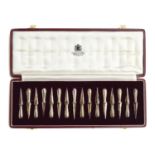 A set of sixteen Asprey & Co corn on the cob holders, in fitted Asprey case