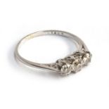 A platinum and diamond trilogy ring, size K, approx. 2.1g