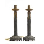 A pair of Gothic revival candlesticks, spelter and brass, later converted to electric, 24.5cm high