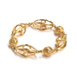 An 18ct gold cage bracelet, comprising five ovoids of square section wire, interspersed with three