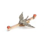 A Victorian swallow bar brooch, the white metal swallow set with old cut diamonds and ruby eyes, the