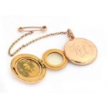 A Victorian 15ct gold locket, patented tri-fold mechanism, with safety chain, 10.7g