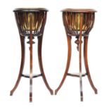 A pair of 19th century urn stands each with removable brass bowl surrounded by beaded swags, on 3