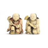 Two Japanese netsukes depicting kneeling priests holding staves, each 6.5cm high