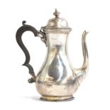 An early 20th century silver coffee pot, with ebonised handle, marks rubbed, 19cm high, 13.2oz