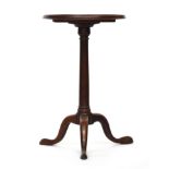A Regency mahogany tripod table, the circular dished top on gun barrel column and cabriole legs with