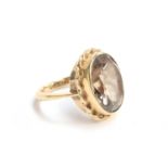 A 9ct gold ring set with a large smoky quartz, size L 1/2, approx. 5.6g