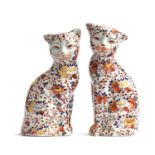 A pair of early 20th century Chinese imari style cat figurines by YaYou Zhen Cang, each signed to