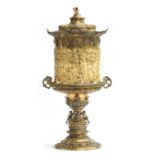 A large silver gilt and carved ivory covered cup by Joseph Fischer 1918, oval campana shape the