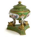 A Sevres potpourri, pierced cover, heightened in gilt, supported on three dolphins on triform