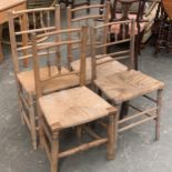 A pair of spindle back ash chairs, with rush seats, together with two others similar (4)