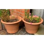 A pair of terracotta plant pots, each 30cmH