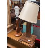 An Art Deco style wooden table lamp, on stepped square base; together with one other