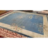 A large blue ground wool rug, said to be in the rooms of Maurice Bowra at Wadham College, 450x360cm