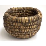 A probably 19th century bee skep/basket bound with bramble, 44cmD