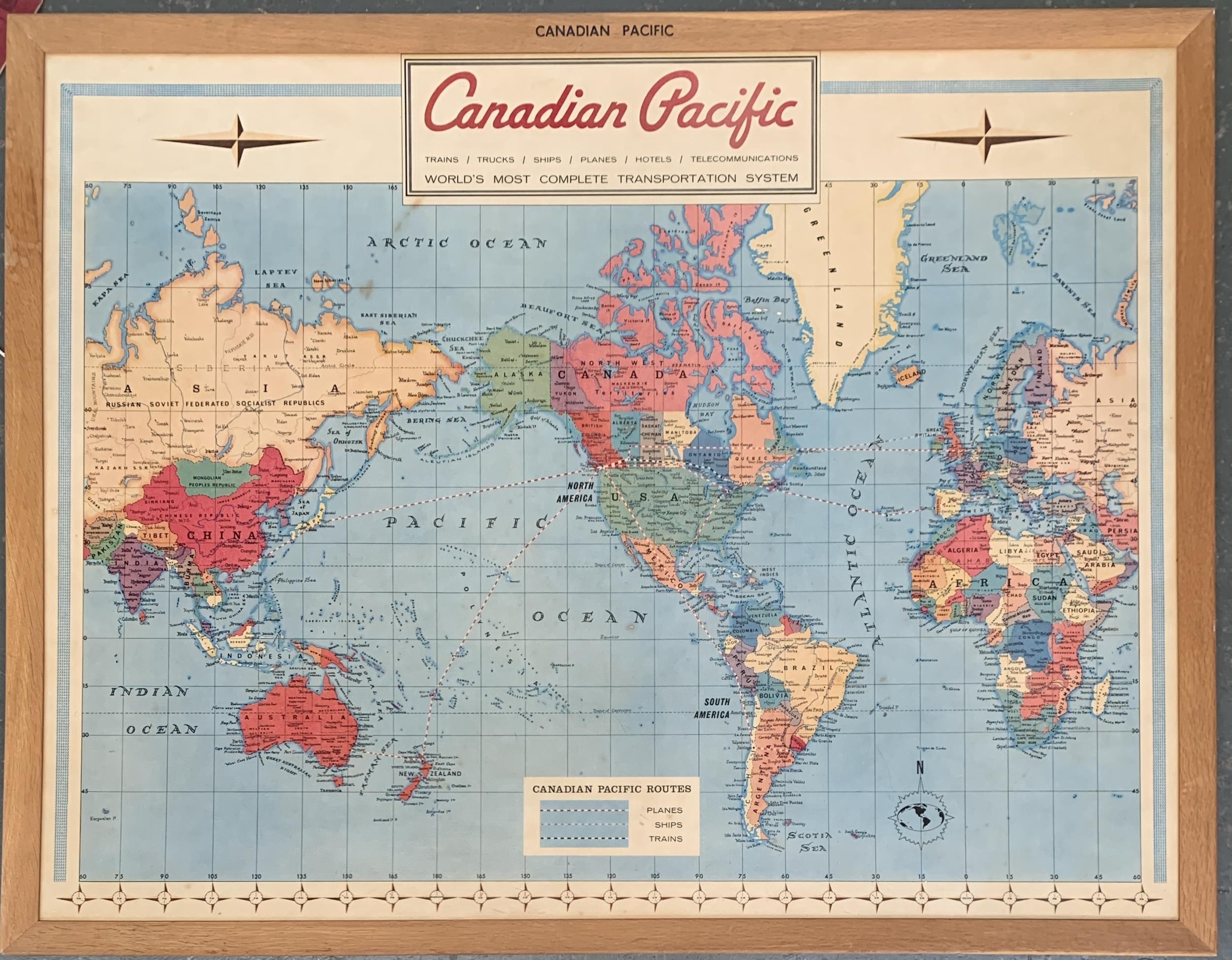 A large Canadian Pacific map of the world, in frame, 94x120cm