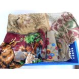 A mixed box of fabric to include throws, tea cosy, needlework, cushion covers etc