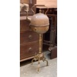 A copper and brass Eastern kettle on stand, with warmer, 106cmH