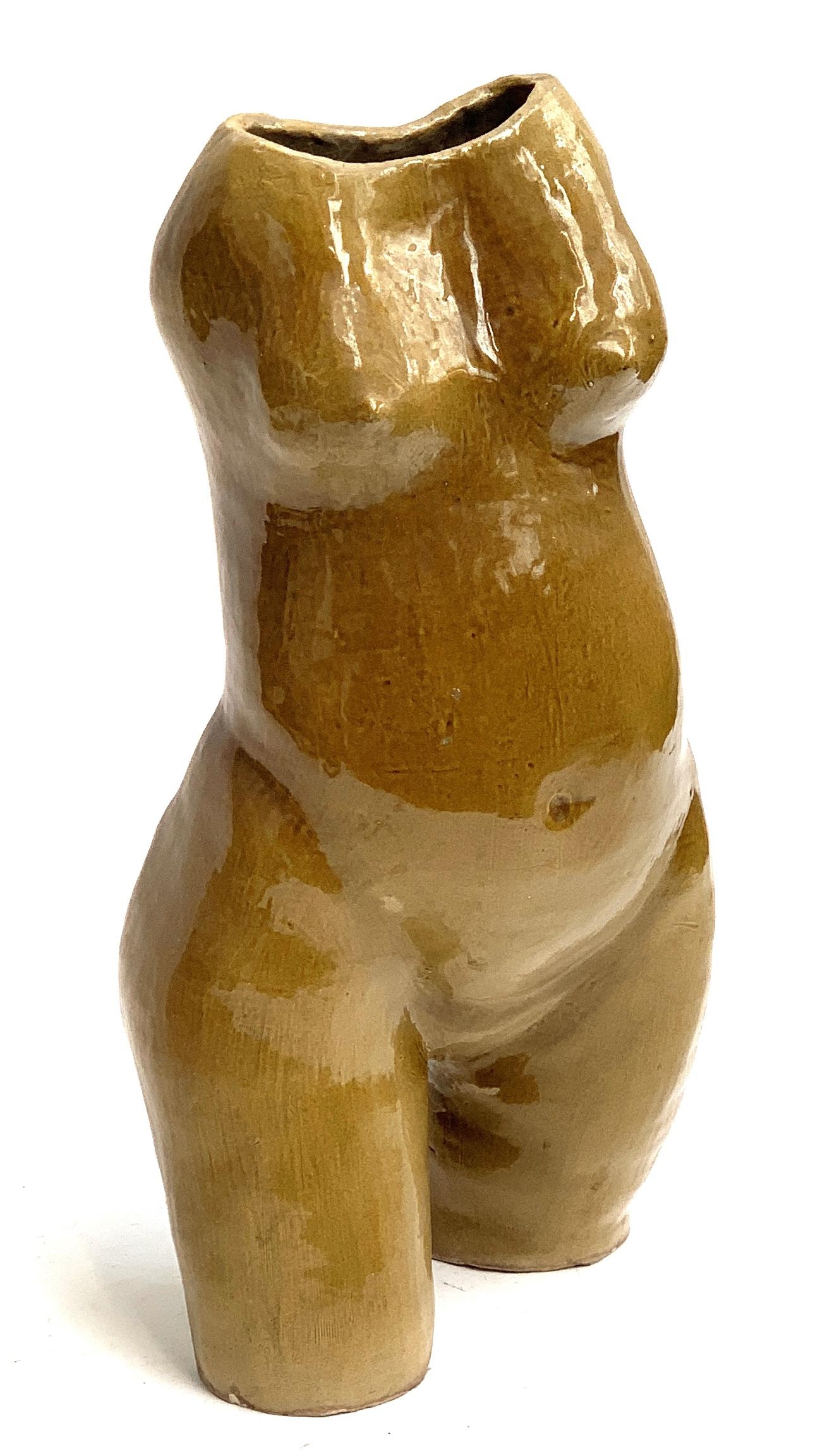 A glazed ceramic female torso, 48cmH