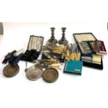 A mixed lot to include plated wares , a pair of candlesticks, silver handled butter knife, fish