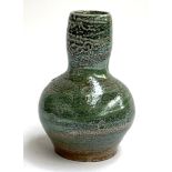 A Micki Schloessingk pottery vase with shell decoration, 21cmH