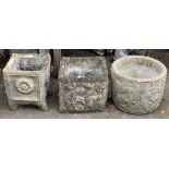 Three composite stone planters, each approx. 30cmH (two square, one circular)