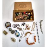 A mixed lot of interesting things to include amber coloured beads; scent bottle; buttons etc