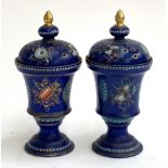 A pair of 19th century potpourris, hand painted with stands of armour on a cobalt ground, each 16cmH