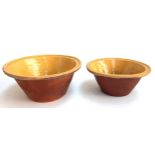 Two Victorian glazed terracotta milk bowls, 32cmD and 28.5cmD