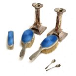 A set of silver and blue guilloche enamel brushes by Reid and Sons; two salt spoons; and two