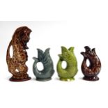 A Fosters pottery sea horse jug, 29cmH, together with 3 glug jugs, Dartmouth, Fosters and