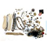 A mixed lot of costume jewellery to include faux pearls, brooches, enamel earrings etc