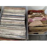 A clear plastic crate of vinyl LPs; together with a further crate of 78s