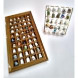 A collection of thimbles to include Royal Crown Derby, Portmeirion, Royal Worcester, Limoges etc