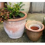 Three small terracotta plant pots, the largest 30cmH