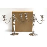 A pair of silver plated three arm candlesticks, 41cmH