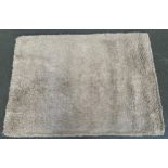 A thick shag rug, 228x168cm