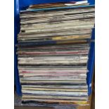 A large blue crate of vinyl LPs, mostly classical