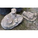 A composite stone figure of otters; together with one of a cat