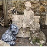 A composite stone figure of a gent on a bench; together with a composite stone figure of a dog and