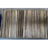 A large clear plastic crate containing mostly classical LPS