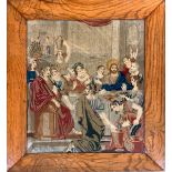 A 19th century Biblical needlework tapestry depicting The Wedding Feast at Cana, in an oak frame,