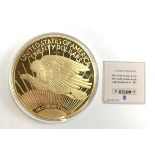 A 1933 Gold Double Eagle $20 proof coin layered in 24k gold with certificate of authenticity
