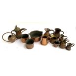 A large lot of 19th century and later copper items, mostly measures, jugs and tankards, dallah