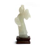 A Chinese celadon jade figure of a scholar, approx. 8cmH, on hardwood base