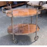 A silver plated two tier hostess trolley, with removeable shaped trays, on oversized casters, 85cmW