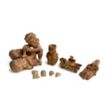 A South American erotic figure group, together with several other clay figures and 4 older fragments