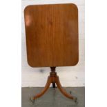 A Regency mahogany rectangular tip-top table, on vase turned column and swept tripod legs, with