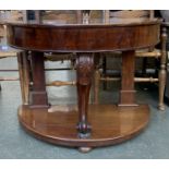 A Victorian mahogany demilune console table, with central carved cabriole support, on undershelf,