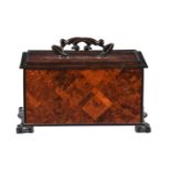 A burr yew and amboyna ebonised box, mid 19th century style, the lid lifting to a vacant interior,